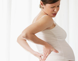 Sår tilbage under graviditetsfoto