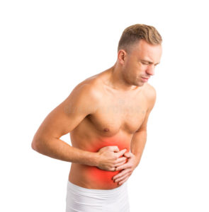 Magen gör ont i en person