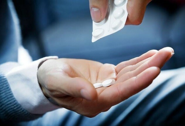 Tabletter i hånden